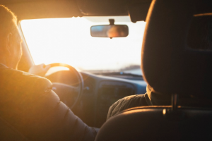 Interior Photo of a Man Driving a Car During Sunset | TheBrakeSquad.com